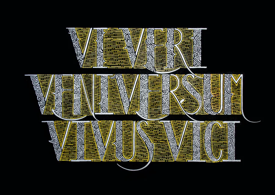 The Latin motto “Vi veri veniversum vivus vici” in three lines of ornamented capitals, silver letters over golden hatching, on black paper.