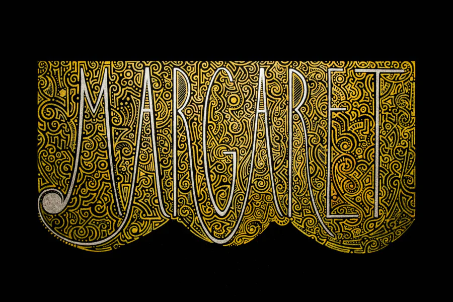 The name “Margaret” in thin silver capitals over a dense golden ornament, on black paper.