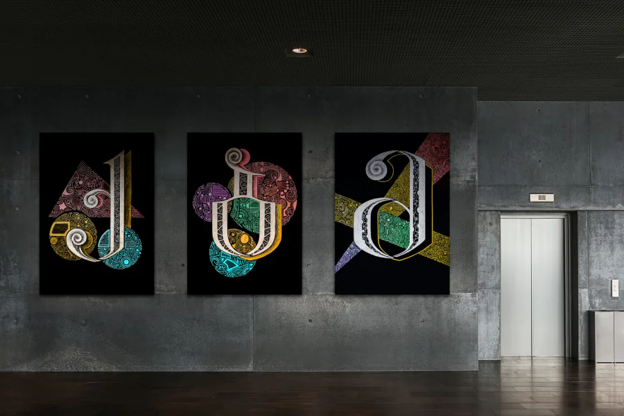 The ornamented Georgian letters Q, B and M shown as large posters on a concrete wall.