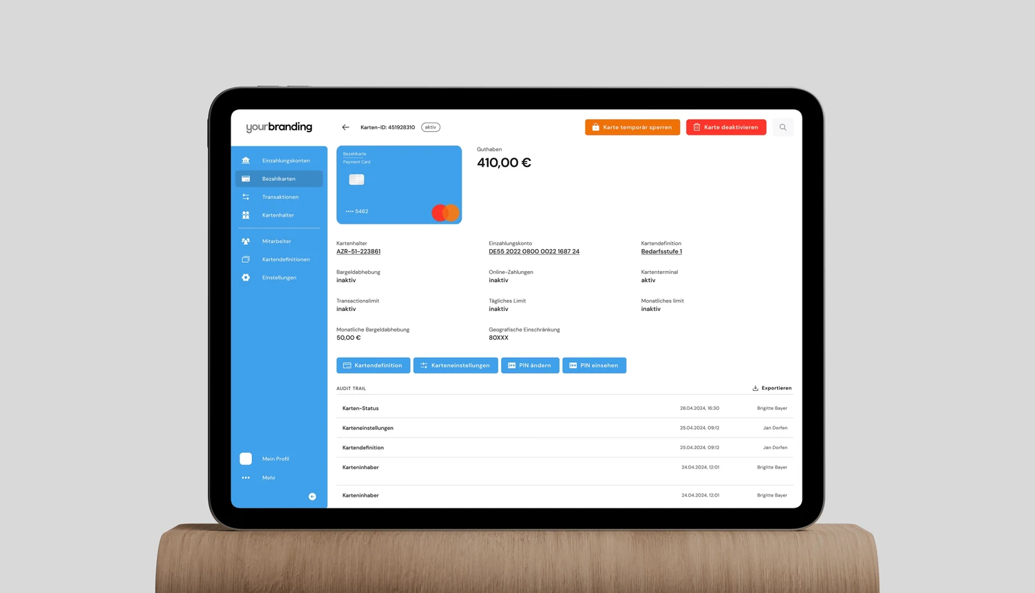 Card detail screen in German under a placeholder brand, showing an audit trail of changes with timestamps and user names