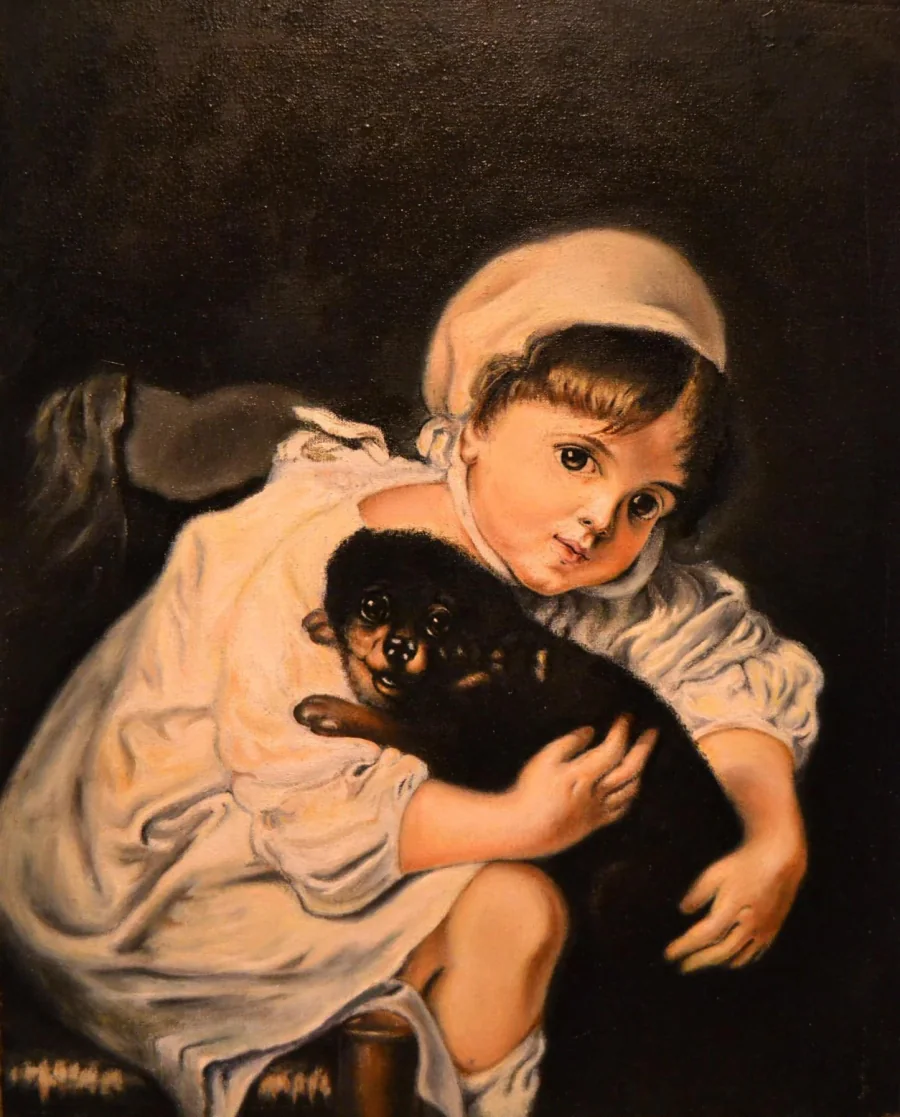 Oil painting of a small child in a white dress and cap holding a black puppy, against a dark background.